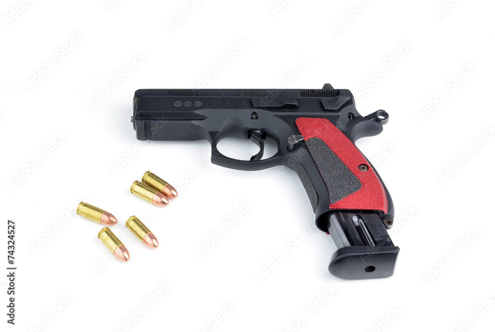 Black gun and 9mm bullets isolated a white background.