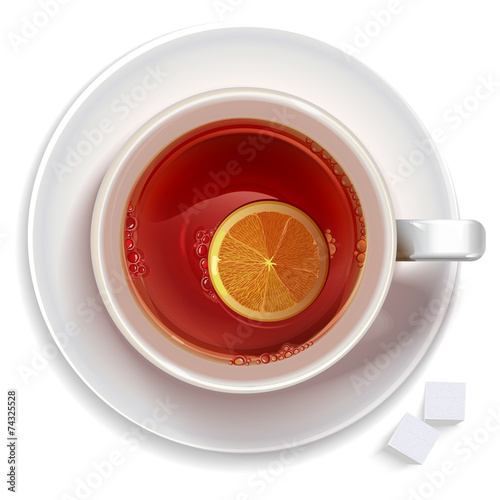 Cup of black tea with lemon,sugar standing on a saucer