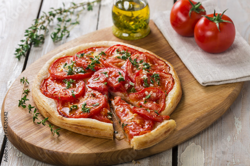 pie with tomato tart of puff pastry photo