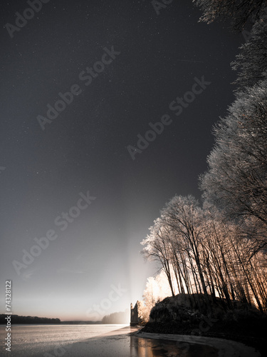 night sky with stars in the winter night with trees. vintage