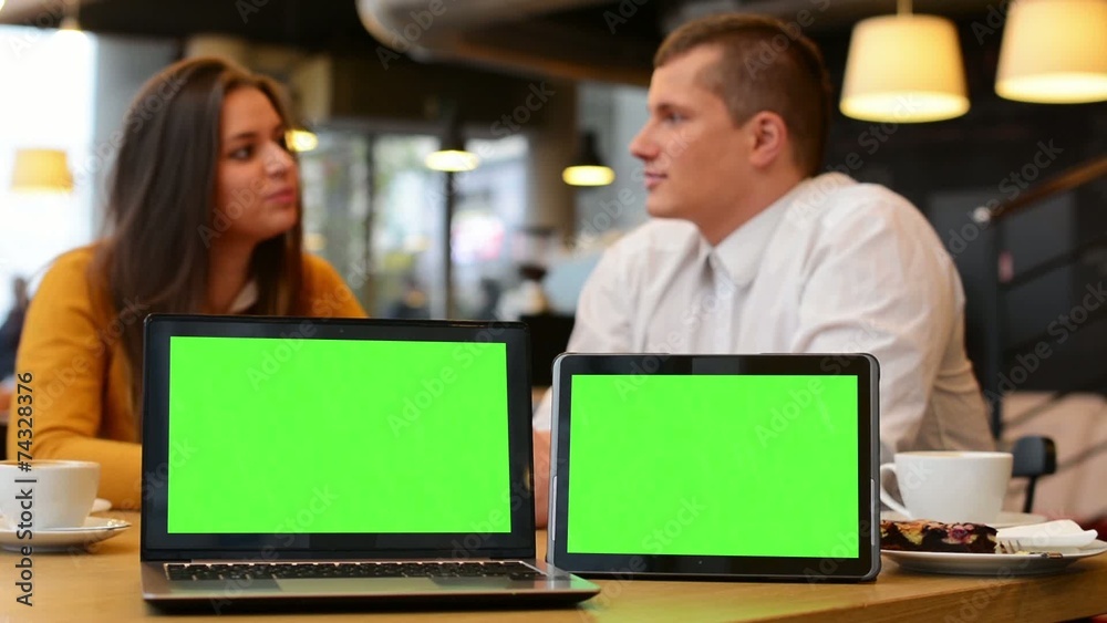 computer and tablet green screen - happy couple smiles computer and tablet green screen - happy couple smiles