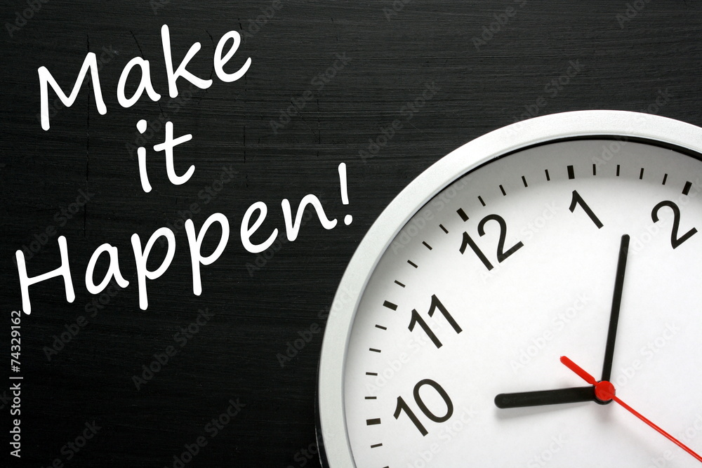 Make it Happen written on a blackboard next to a wall clock Make it Happen written on a blackboard next to a wall clock