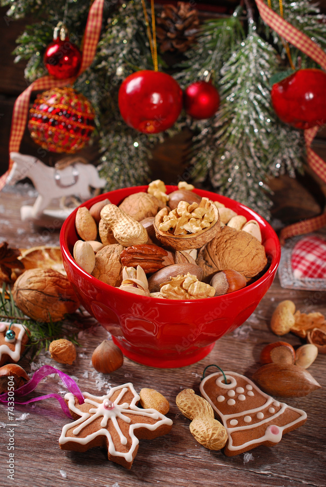 nuts assortment in bowl on wooden table for christmas