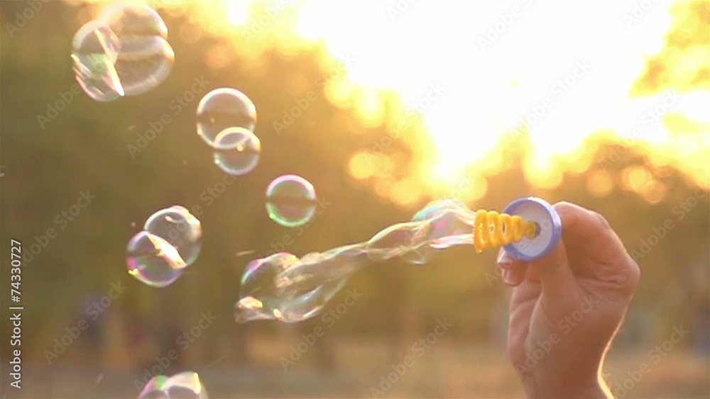 woman blowing soap bubbles 1