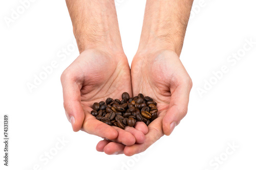 Grains of coffee in hand