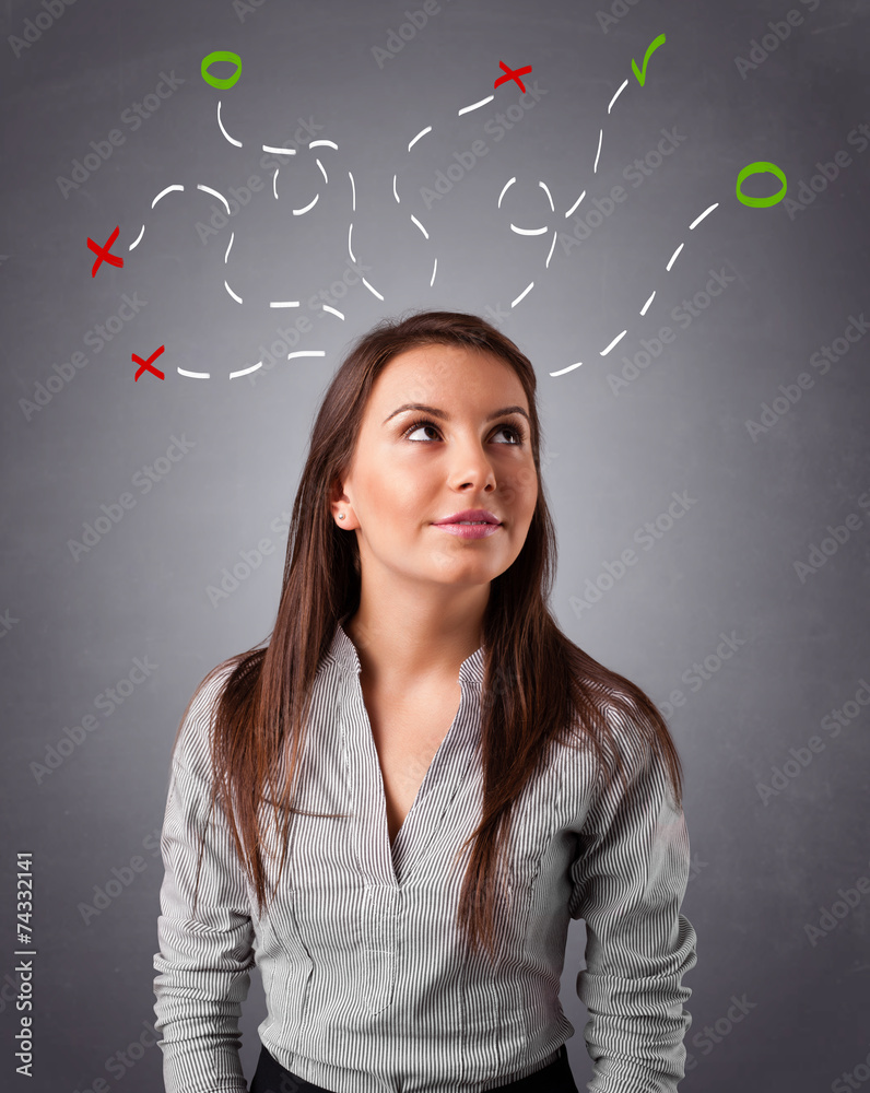 Young woman thinking with abstract marks overhead Young woman thinking with abstract marks overhead