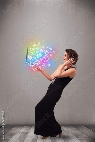 Young lady holding notebook with colorful hand drawn multimedia