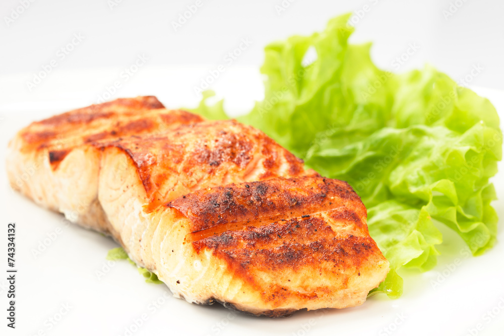 grilled salmon on white plate