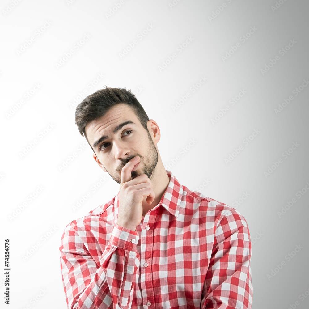 Portrait of thinking man looking up