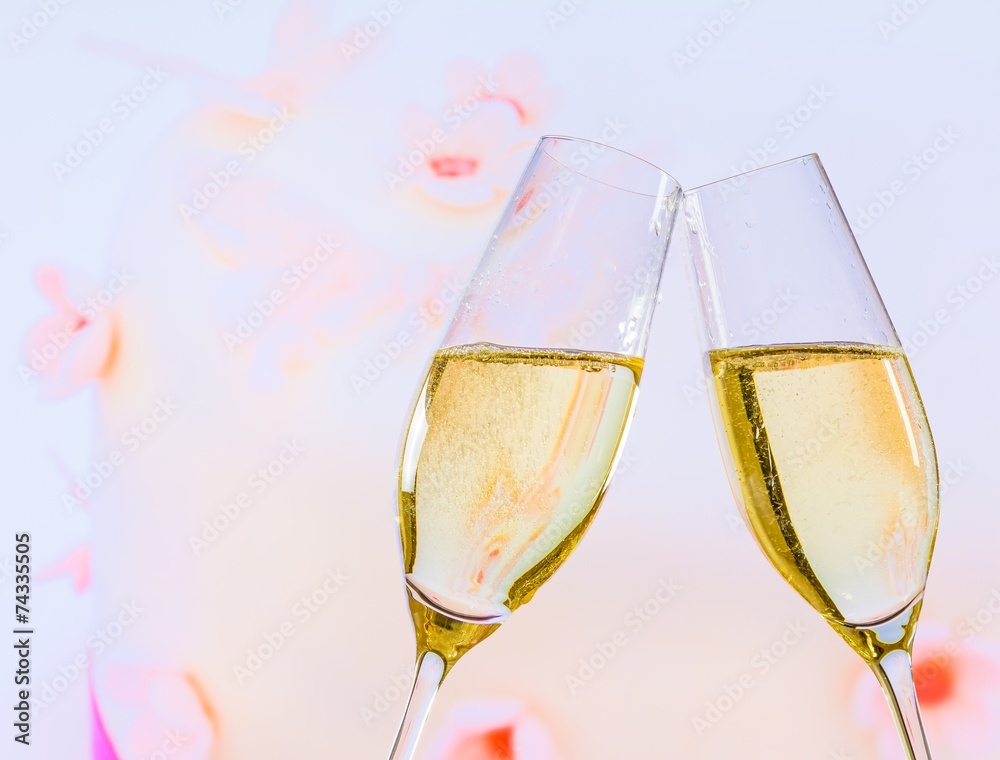 champagne flutes on wedding cake background champagne flutes on wedding cake background
