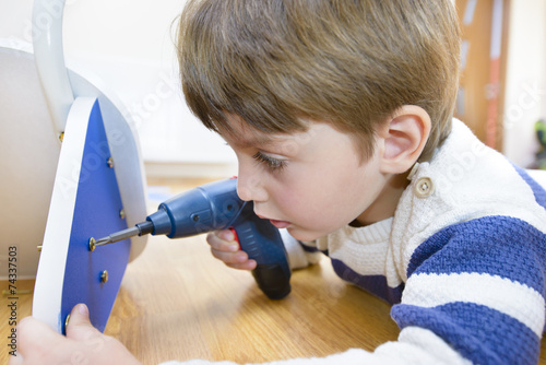 Little Boy using diy tool