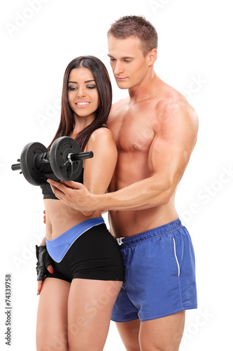 Attractive couple exercising with a weight © Ljupco Smokovski