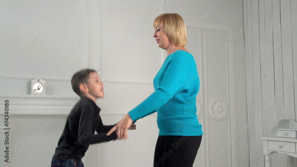 son jumping with his mother, slow motion, dolly son jumping with his mother, slow motion, dolly