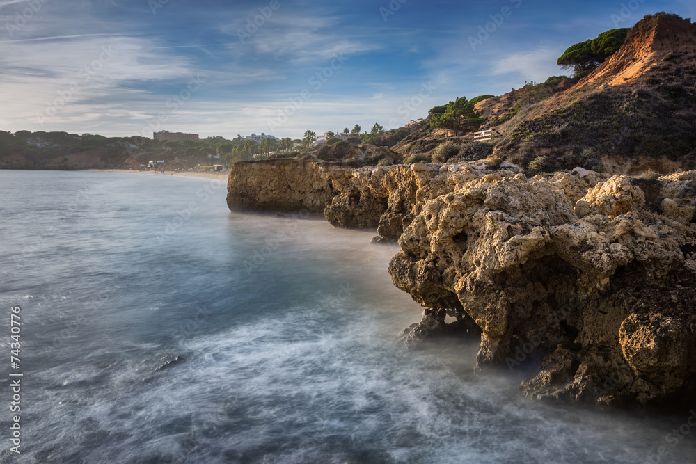 Sea cliffs in Albufeira and the beautiful beach in Portugal.