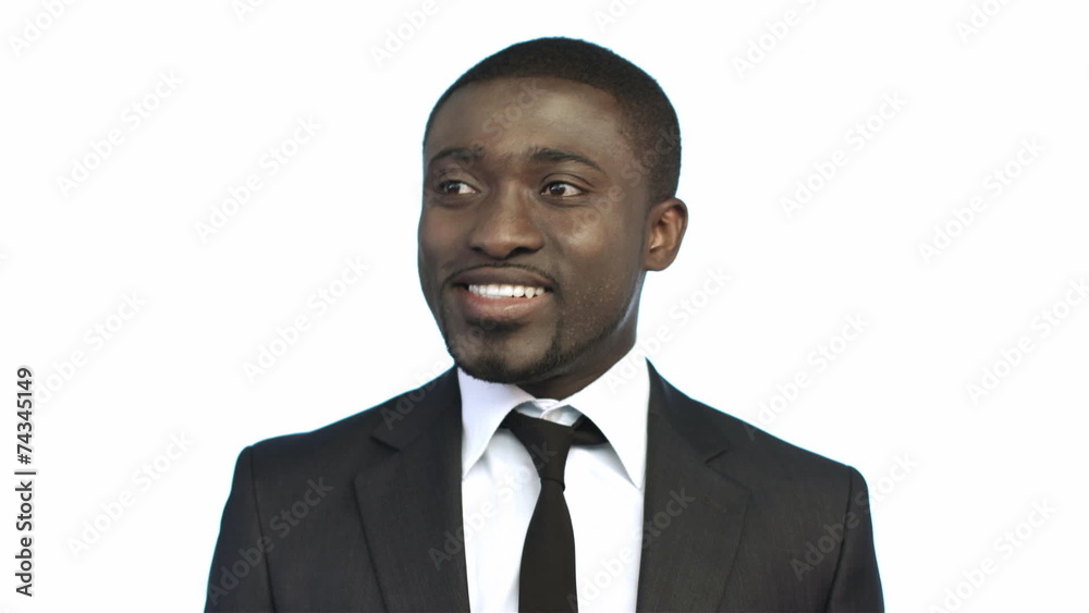 The afro american businessman check the tie and smiles The afro american businessman check the tie and smiles