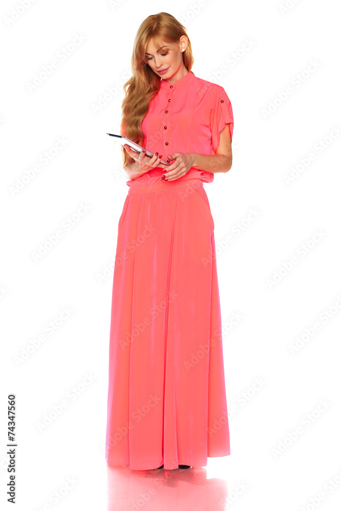 Girl in pink dress with tablet computer Girl in pink dress with tablet computer