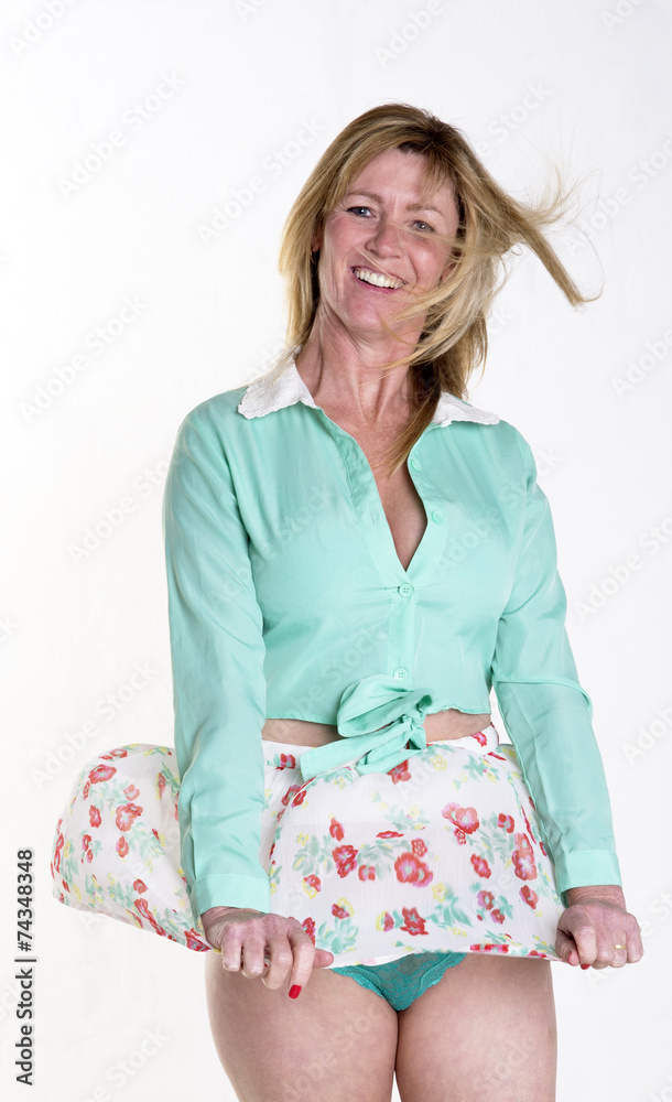 Woman's skirt blowing up in the wind Stock Photo | Adobe Stock