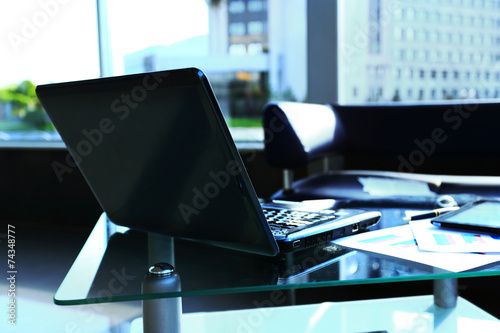 laptop with tablet and smart phone on table