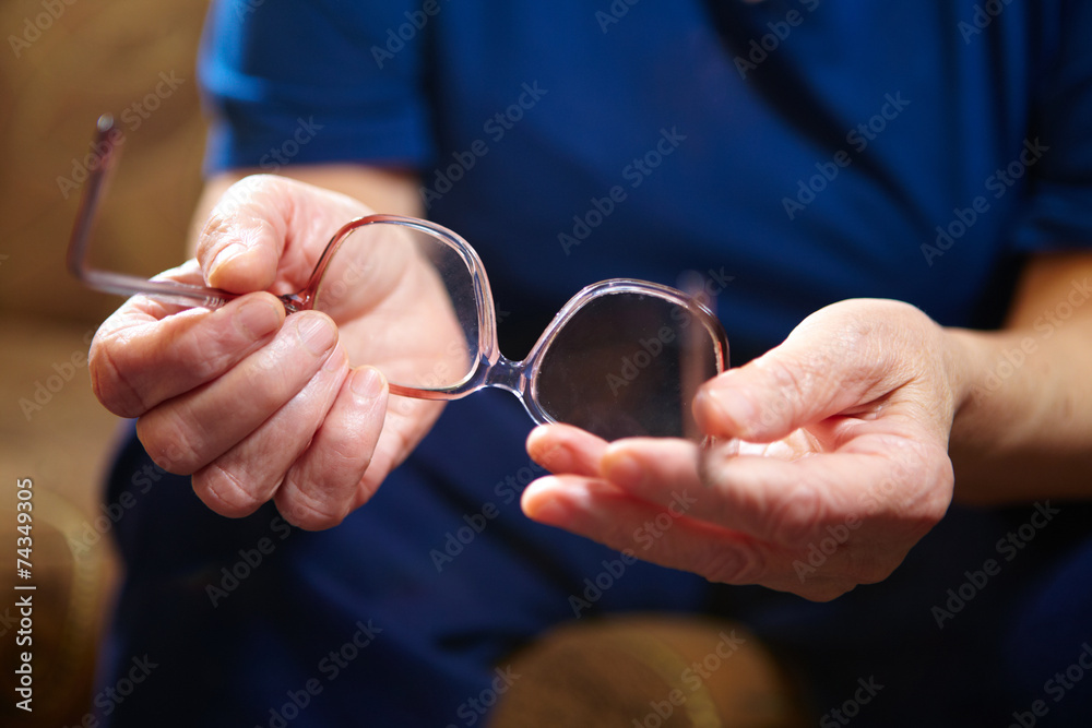 Old woman hands with eyeglasses Old woman hands with eyeglasses