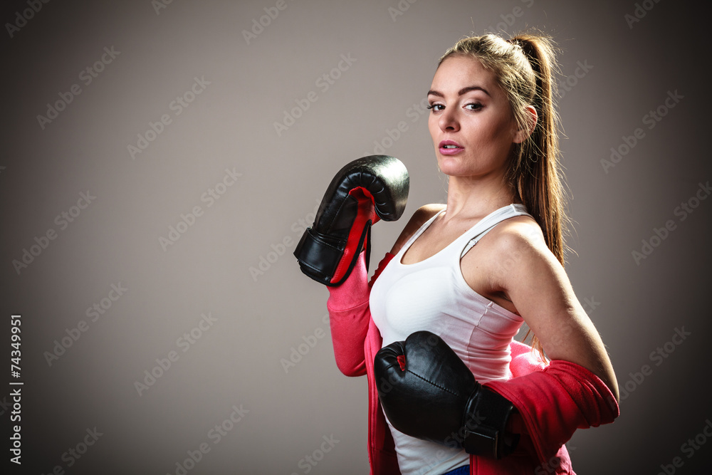 Sport boxer woman in black gloves boxing