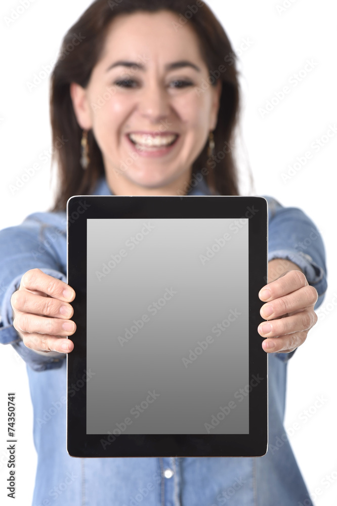 happy Hispanic woman showing digital tablet pad as copy space