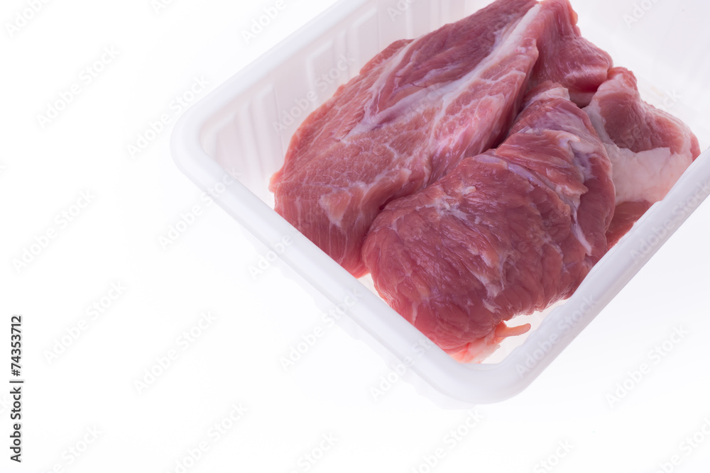 raw pork in plastic box package isolated on white background