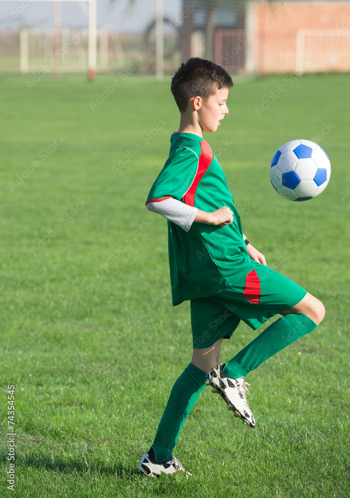 Child playing football