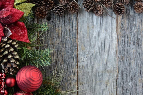 Christmas Decorations with Pine Cones and Rustic Wood Background