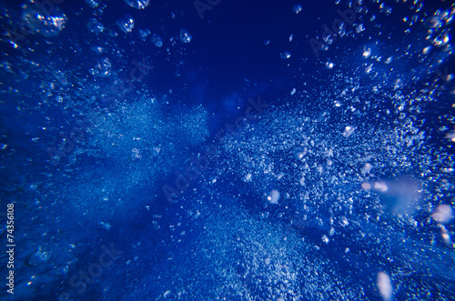 Underwater bubble shot in deep blue tropical sea