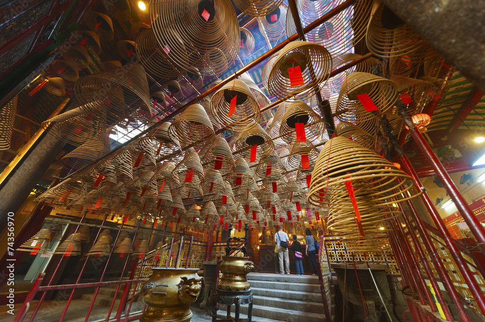 Fototapeta premium The interior of the Man Mo Temple, Hong Kong, with incense offer