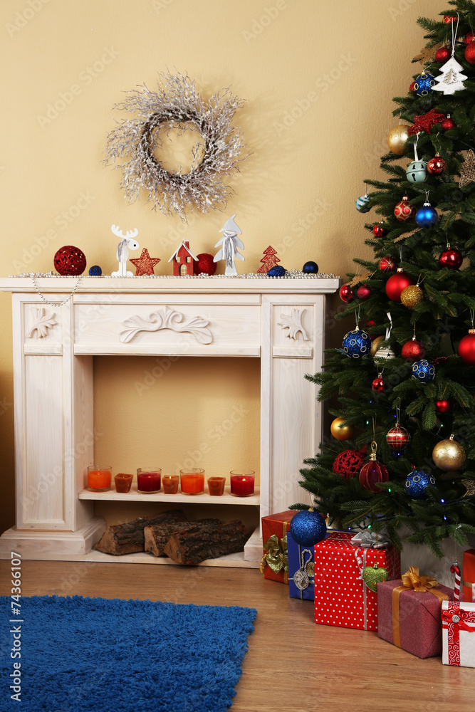 Beautiful Christmas interior with  decorative fireplace and fir
