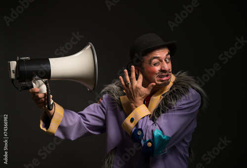 Clown shouting at the megaphone
