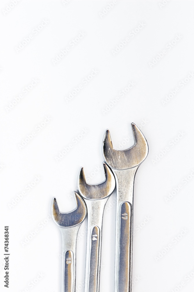 Metal wrenches set isolated on white background. Vertical image Metal wrenches set isolated on white background. Vertical image