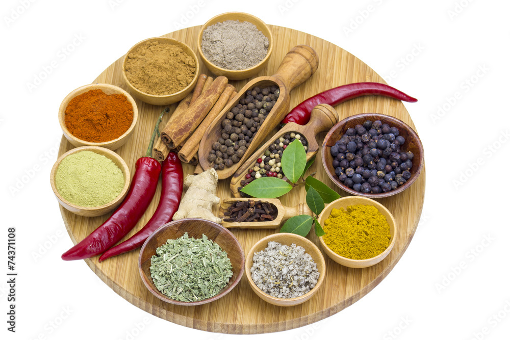 Variety of spices on wooden board Variety of spices on wooden board
