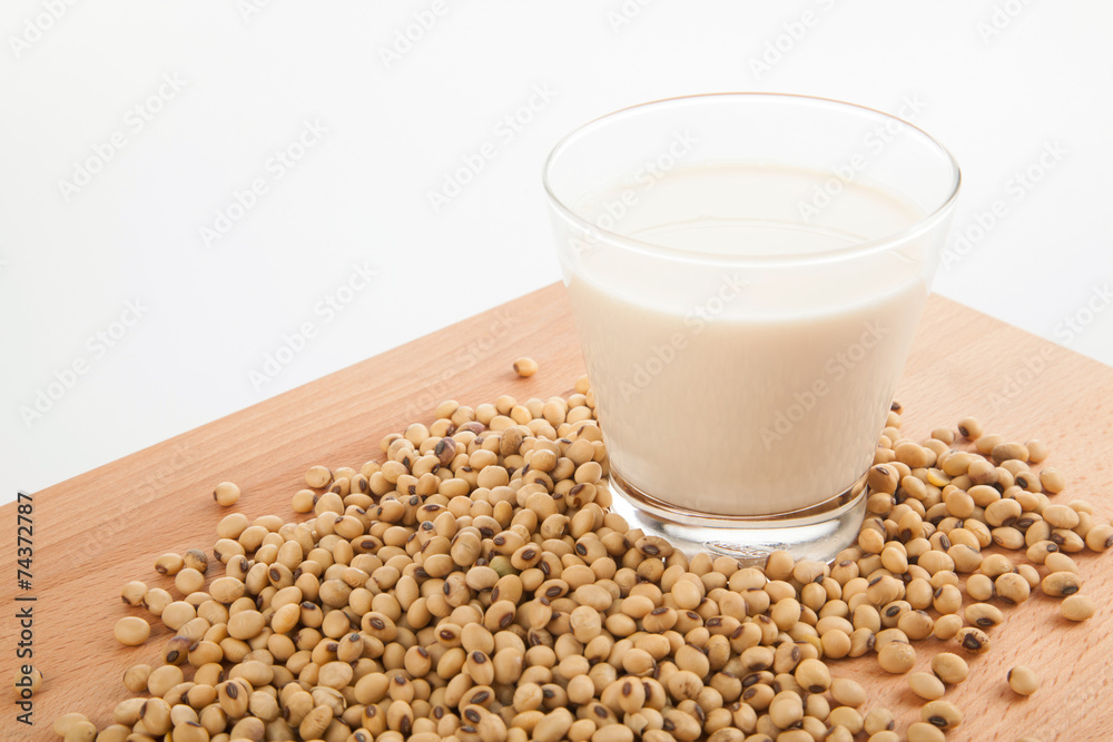 Soy milk in glass with soybeans Soy milk in glass with soybeans