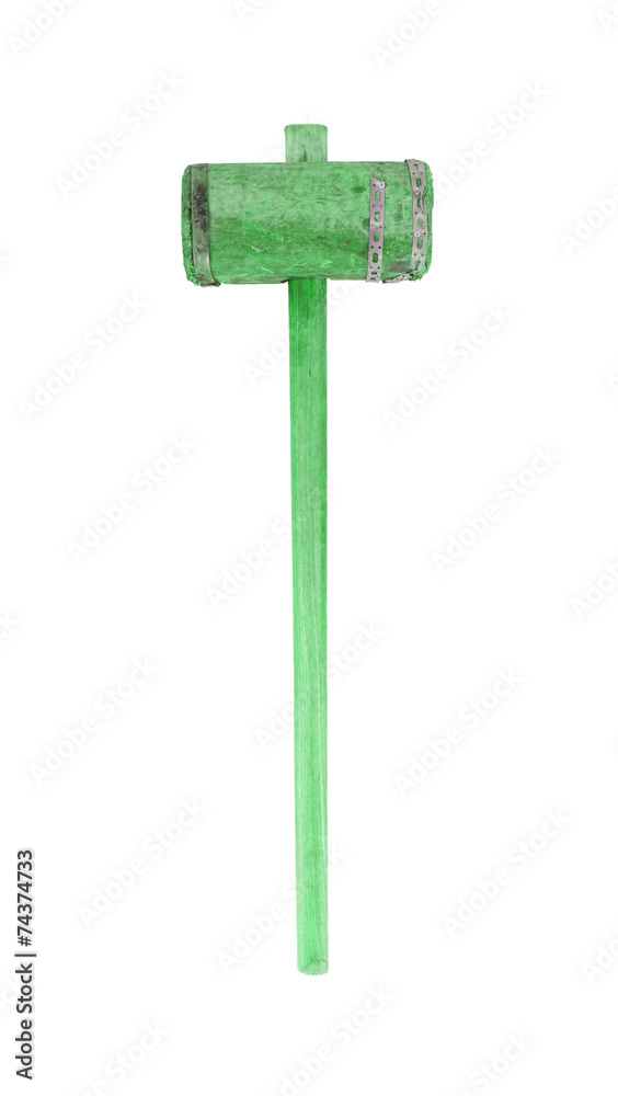 Very old wooden hammer isolated, green