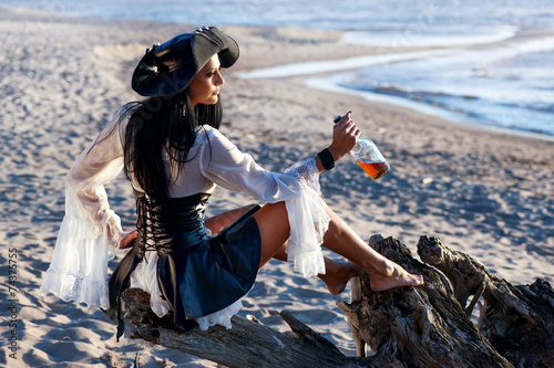 Fototapeta Naklejka Na Ścianę i Meble -  Pirate woman at the beach