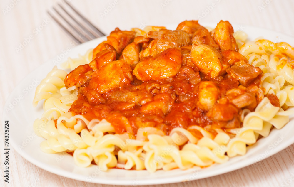 Fusilli pasta with chicken in tomato sauce Fusilli pasta with chicken in tomato sauce
