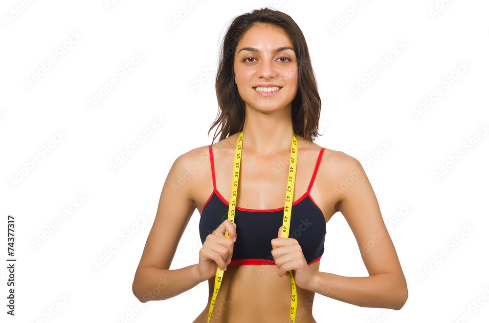 Young girl with centimeter in dieting concept Young girl with centimeter in dieting concept