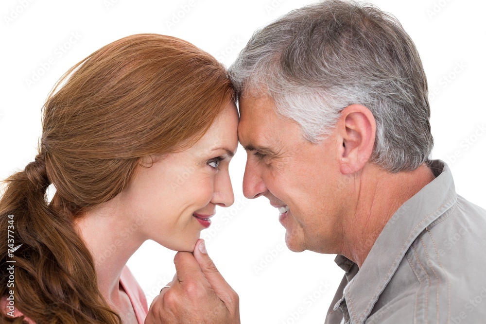 Casual couple smiling at each other Casual couple smiling at each other