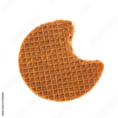 Bite of the typical Dutch stroopwafel (Caramel waffle).