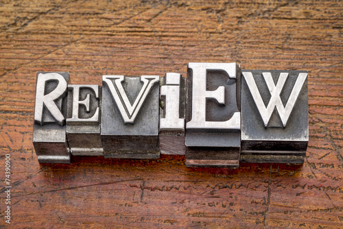 review word in metal type photo