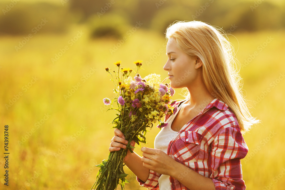 Happy girl with a bouquet of wildflowers Happy girl with a bouquet of wildflowers