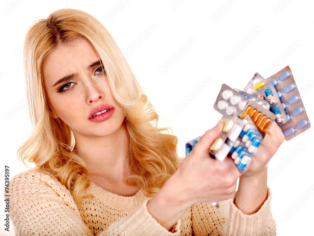 Woman having flu takes pills.