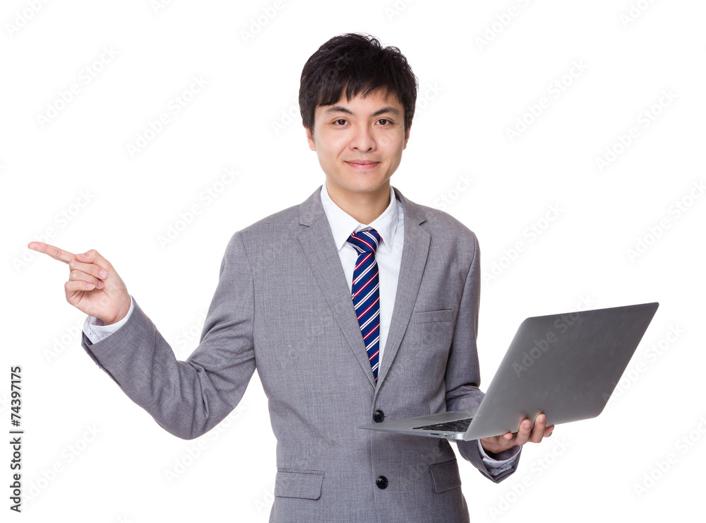 Businessman use of notebook with finger point up Businessman use of notebook with finger point up