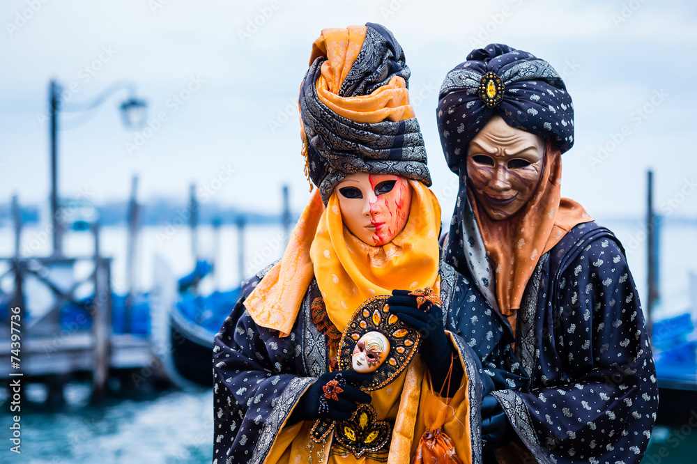 Couple in typical dress poses during Venice Carnival