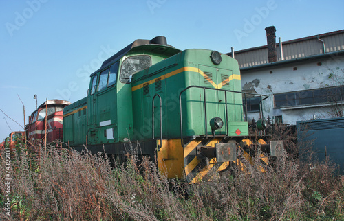 Old abandoned  trains at  depot in sunny day © patrikslezak