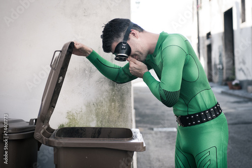 Superhero opening a trash bin photo