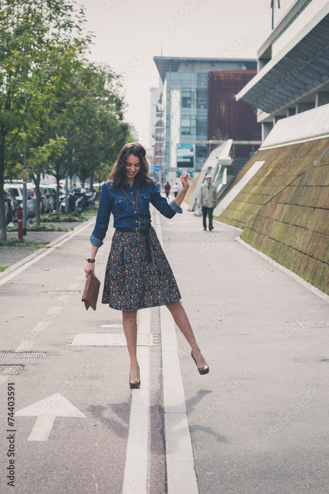 Pretty girl posing in the city streets Pretty girl posing in the city streets