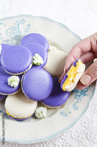 Colored makarons with tangerine ganache photo